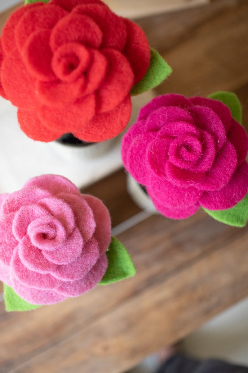 Beautiful felted blooms in a variety of colors that bring a touch of whimsy to your decor. Perfect for use on champagne bottles, but can be used on any wine bottle. Set of 3.